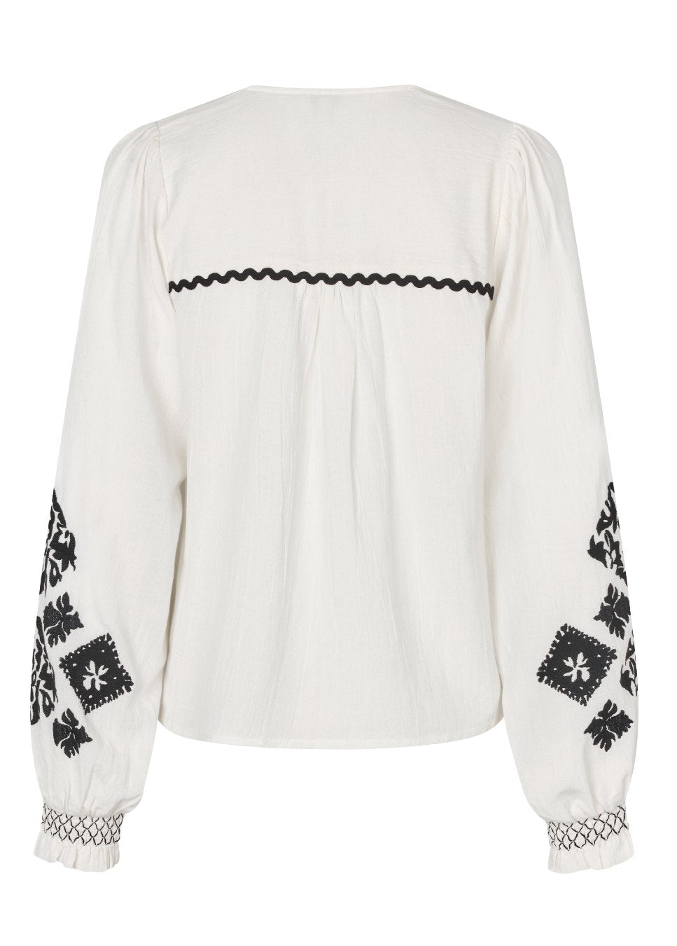 product foto achterkant van de mbyM Kanja-M blouse met zwart details op de mouwen en rug.
